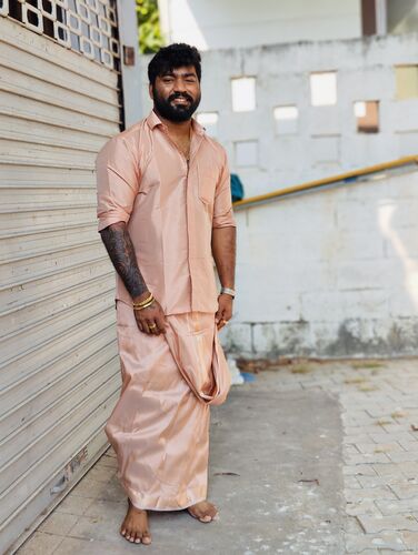 Men's wear combo pack features rose gold polyester full-sleeve readymade  shirt, zari border dhoti & angavastram